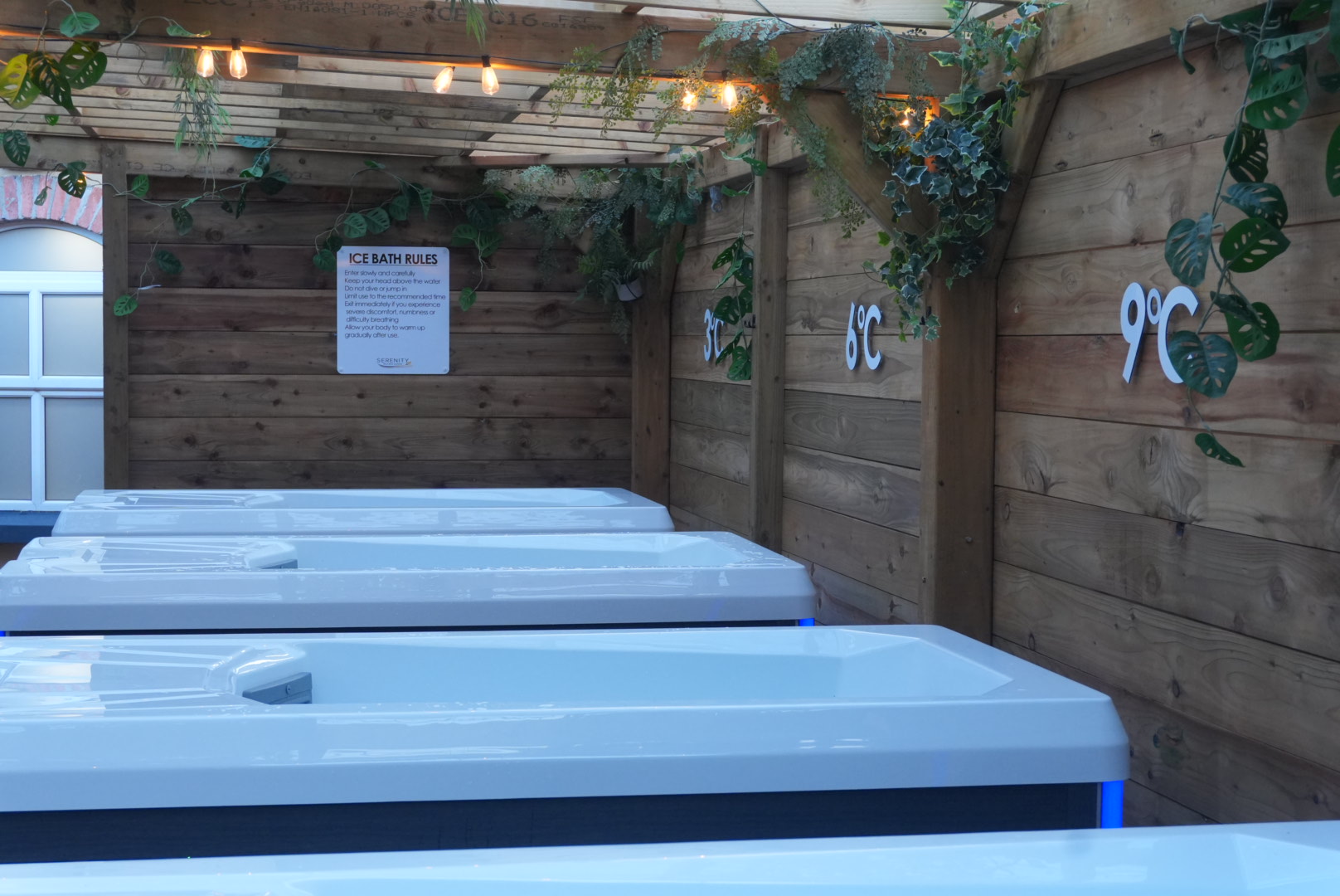 Row of ice baths with temperature signs