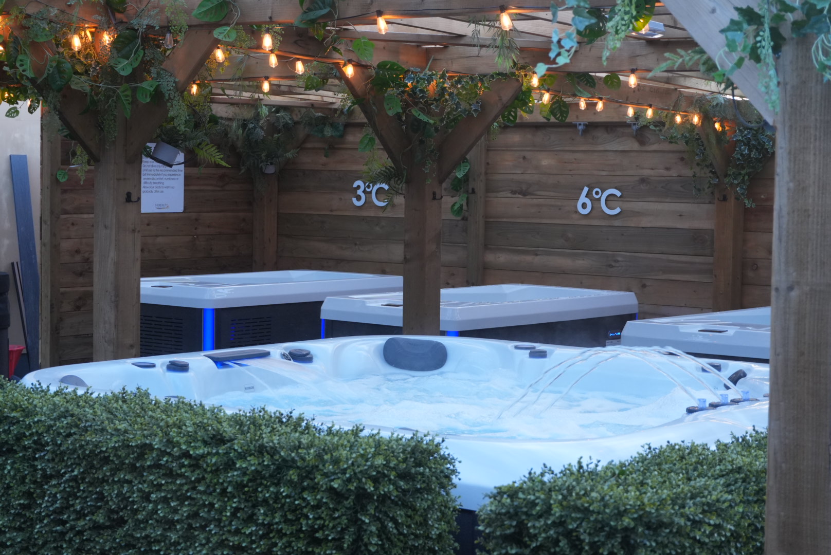 Serenity Wellness Garden pergola with lights and hot tub